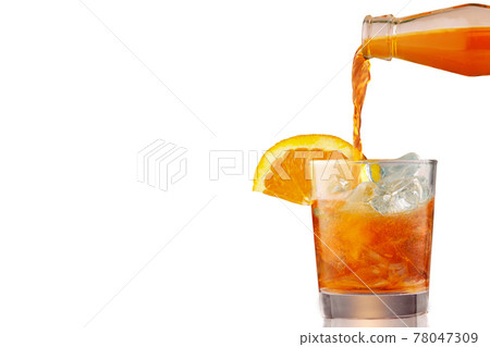 Glass of iced cold aperol spritz cocktail decorated with slices of orange. Aperitif, making coctail, pouring liquid into glass full of ice, isolated on white background. Glass of iced cold aperol spritz cocktail decorated with slices of orange. Aperitif, making coctail, pouring liquid into glass full of ice, isolated on white background. 78047309