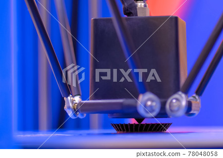 Modern 3D printer machine printing plastic model at exhibition - close up 78048058