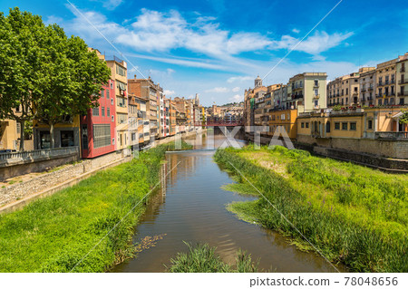 Colorful houses and Eiffel bridge in Girona 78048656