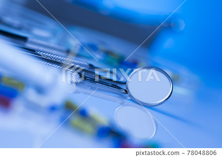Dentist equipment on blue background 78048806