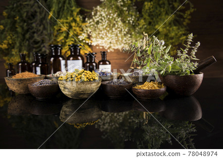 Black mirror background, Natural remedy, healing herbs Black mirror background, Natural remedy, healing herbs 78048974