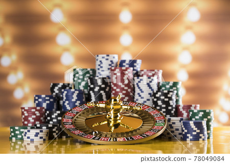 Roulette wheel running in a casino, Poker Chips Roulette wheel running in a casino, Poker Chips 78049084