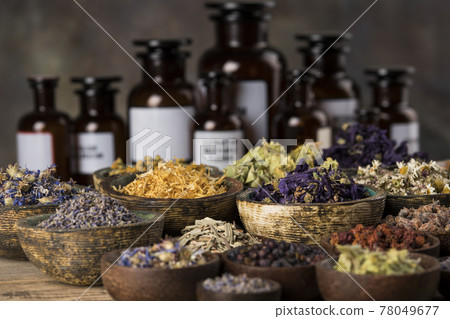 Natural medicine and mortar, healing herbs background 78049677