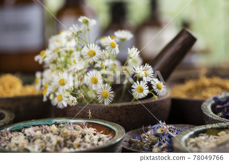 Natural remedy and wooden table background 78049766