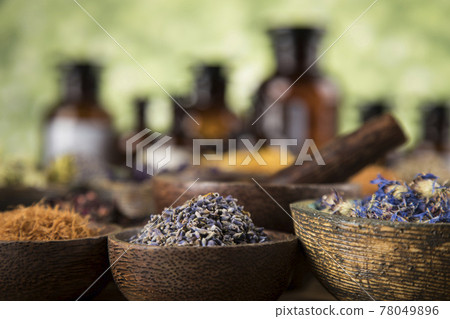 Natural medicine and mortar, healing herbs background Natural medicine and mortar, healing herbs background 78049896