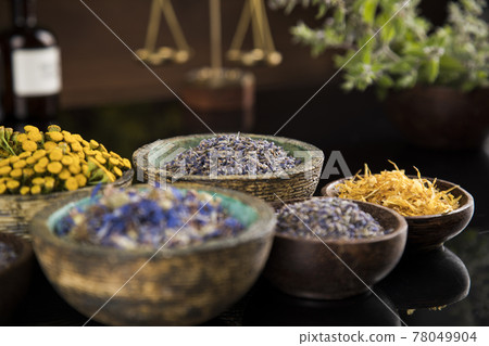 Natural medicine in black mirror background Natural medicine in black mirror background 78049904