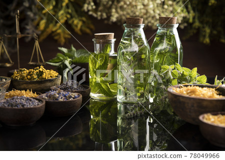 Oil, Natural remedy, healing herbs background Oil, Natural remedy, healing herbs background 78049966