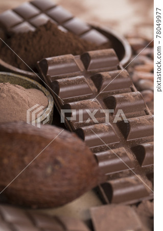 Chocolate sweet, cocoa pod and food dessert background Chocolate sweet, cocoa pod and food dessert background 78049977