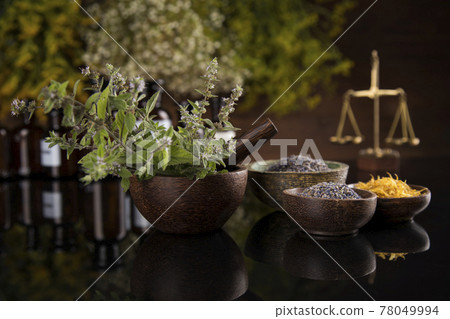 Natural medicine in black mirror background Natural medicine in black mirror background 78049994