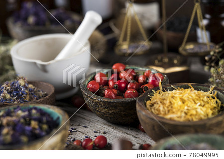 Natural remedy, mortar and herbs 78049995