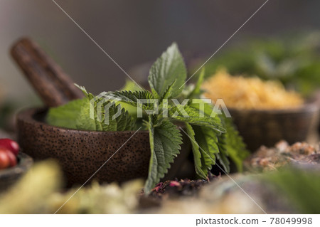 Natural remedy and wooden table background Natural remedy and wooden table background 78049998