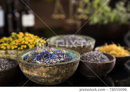Natural medicine in black mirror background Natural medicine in black mirror background 78050096