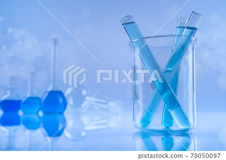 Laboratory beakers, microscope, blue background Laboratory beakers, microscope, blue background 78050097