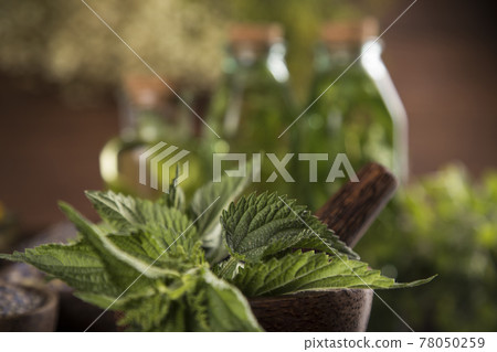 Oil, Natural remedy, healing herbs background Oil, Natural remedy, healing herbs background 78050259