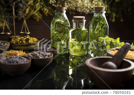 Oil, Natural remedy, healing herbs background 78050281
