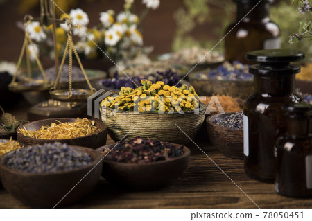 Homeopathy, herbal medicine on wooden table Homeopathy, herbal medicine on wooden table 78050451