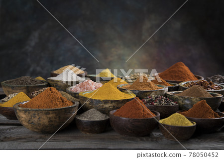 Aromatic spices on wooden background 78050452