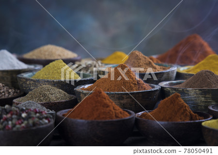 Spices and herbs in wooden bowl Colorful spices  78050491