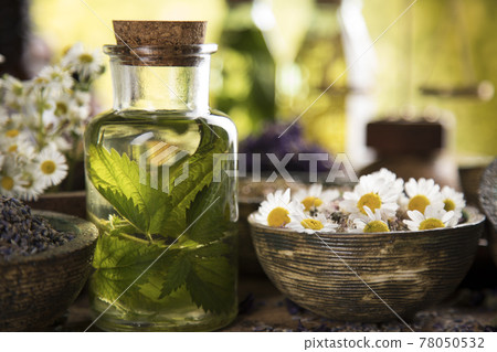 Natural medicine and mortar, healing herbs background 78050532