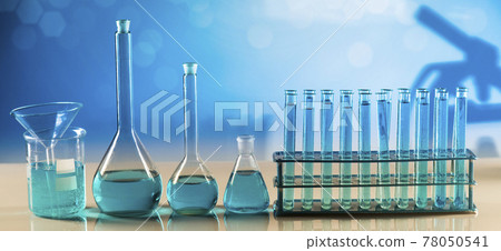 Laboratory beakers,Science experiment, blue background Laboratory beakers,Science experiment, blue background 78050541