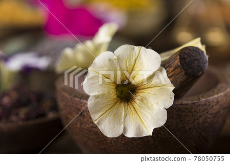 Natural remedy and wooden table background Natural remedy and wooden table background 78050755