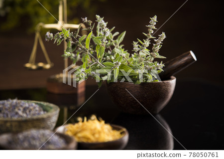 Black mirror background, Natural remedy, healing herbs Black mirror background, Natural remedy, healing herbs 78050761
