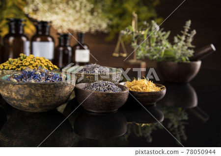 Natural medicine in black mirror background Natural medicine in black mirror background 78050944