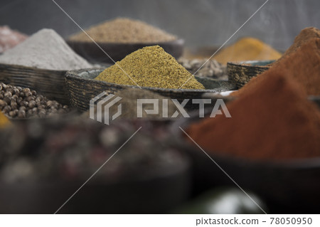 Spices and herbs in wooden bowl Colorful spices 78050950