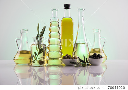 Bottles of olive oil, olive branch and Cooking oils Bottles of olive oil, olive branch and Cooking oils 78051020