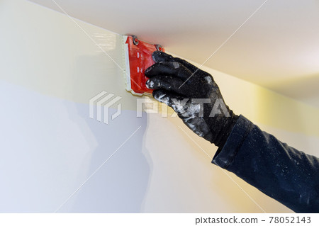 Construction tool for working contractor user in corner paint edger brush painter hands in the painting the wall 78052143