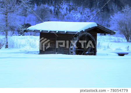 Snow-covered watermill 78054779