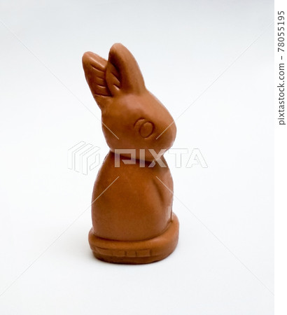 bunny shaped chocolate on white background 78055195