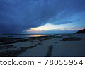 [Okinawa material] Take a picture of the moment when a big cloud moves and an evening cloud appears on the beach 78055954