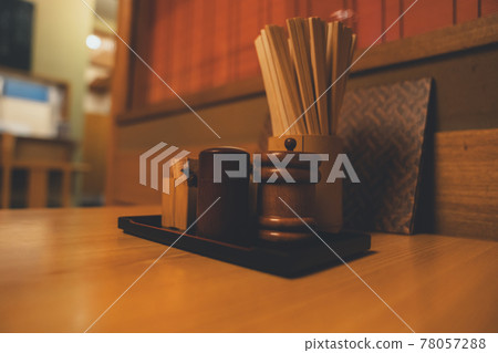 Seasonings on the restaurant table 78057288