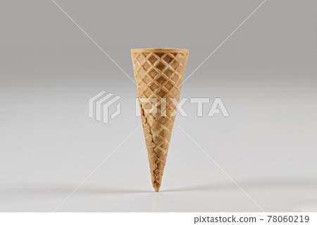Empty wafer cone for ice cream isolated on white. Concept of food, treats. Mockup, template for your advertising and design. Close up 78060219