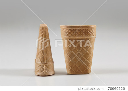Two empty, big wafer cups for ice cream isolated on white. Concept of food, treats. Mockup, template for your advertising and design. Close up 78060220