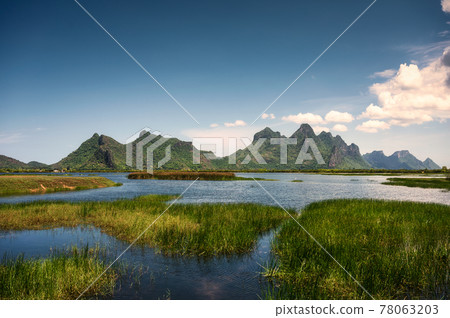 Green mountain range of Khao Sam Roi Yot on wetland and blue sky in national park at Prachuap Khiri Khan 78063203