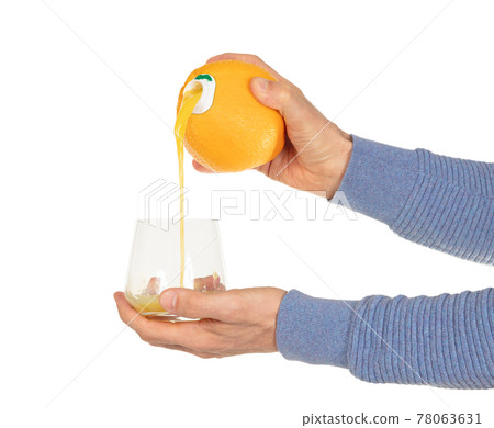 Orange juice pouring in glass Orange juice pouring in glass 78063631