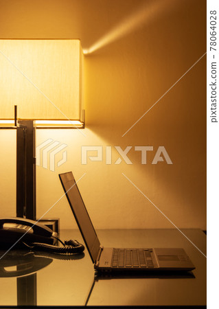 A laptop computer placed at the desk A laptop computer placed at the desk 78064028