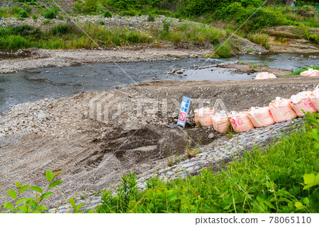 River construction before the typhoon season Sandbags 78065110