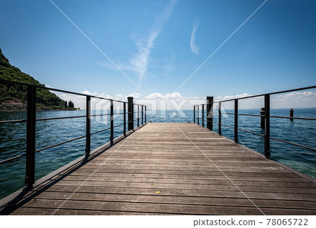 Small Wooden Pier on Lake Garda - Lago di Garda Veneto Italy 78065722