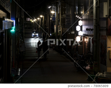 A bar in a back alley that is quiet due to the corona A bar in a back alley that is quiet due to the corona 78065809