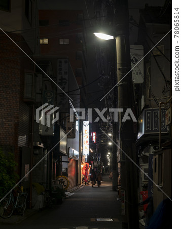 A bar in a back alley that is quiet due to the corona A bar in a back alley that is quiet due to the corona 78065814