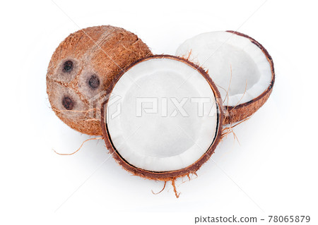 Whole and cracked coconuts isolated on white background. De-husked coconut fruits showing the characteristic three pores. Cut in half coconut closeup. 78065879