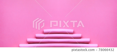 Pink foam curlers on soft pastel background. Hair accessories 78066432