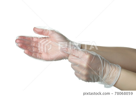 Female hands in disposable gloves isolated on white background 78068059