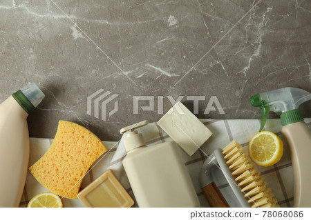 Cleaning concept with eco friendly cleaning tools on gray textured table 78068086