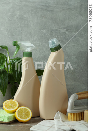 Cleaning concept with eco friendly cleaning tools on gray textured table 78068088