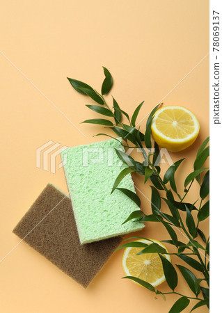 Sponges, branch and lemons on beige background 78069137
