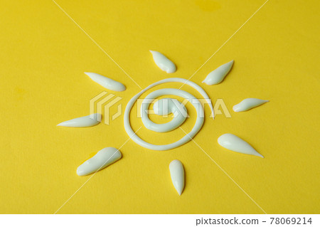 Sun made of sunscreen on yellow background Sun made of sunscreen on yellow background 78069214